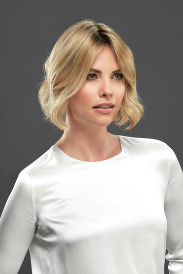 Woman with hair loss wearing the Euro Easipart French Knotted 8 Inch Hair Topper by Jon Renau